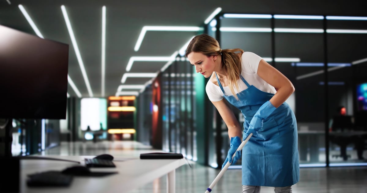Professional cleaner using commercial-grade equipment